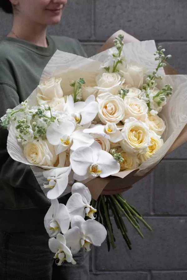 Opulent white flower bouquet with orchids
