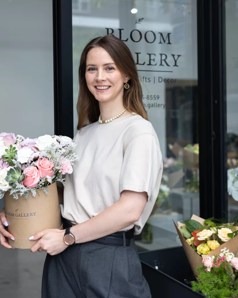 Owner at the front of the flower shop